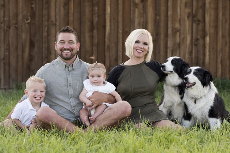 Board Chair Aaron Schwieterman with is family and two dogs.